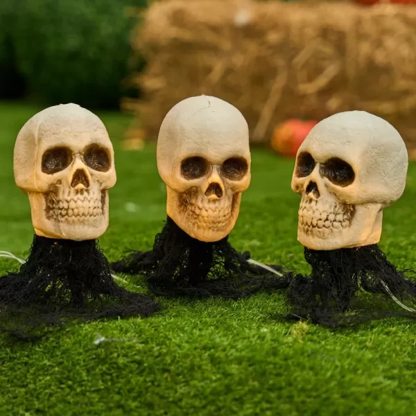 JOYIN 3 Pcs Halloween Skeleton Decorations Outdoor Light Up Halloween Graveyard Skull Stakes Pathway Makers for Halloween Party Lawn Props Yard Decor