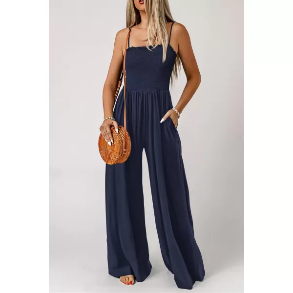imagePRETTYGARDEN Womens Summer Jumpsuits Dressy Casual One Piece Outfits Linen Smocked Spaghetti Strap Pockets Wide Leg RompersNavy