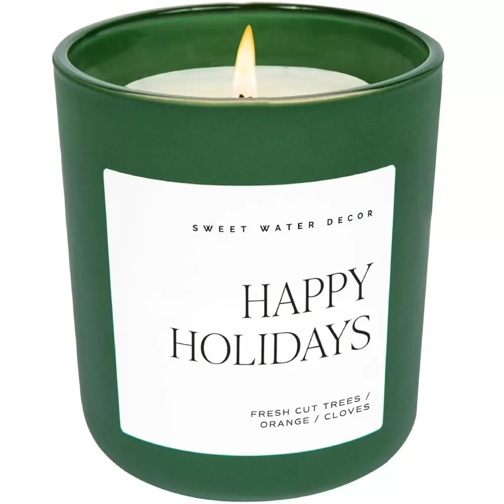 imageSweet Water Decor By The Fireside Candle  Vanilla Caramel Amber Tonka Smoky Woods Musk Winter Scented Soy Candles for Home  15oz Tan Jar 70 Hour Burn Time Made in the USAGreen