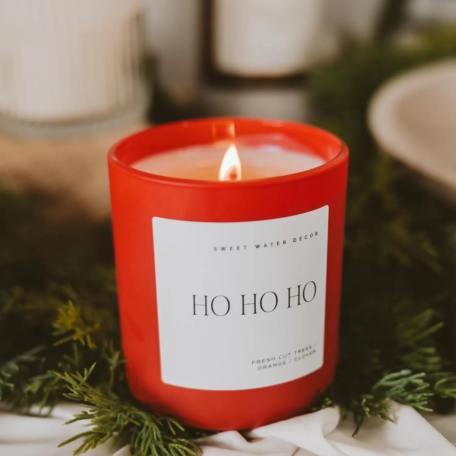 imageSweet Water Decor By The Fireside Candle  Vanilla Caramel Amber Tonka Smoky Woods Musk Winter Scented Soy Candles for Home  15oz Tan Jar 70 Hour Burn Time Made in the USARed