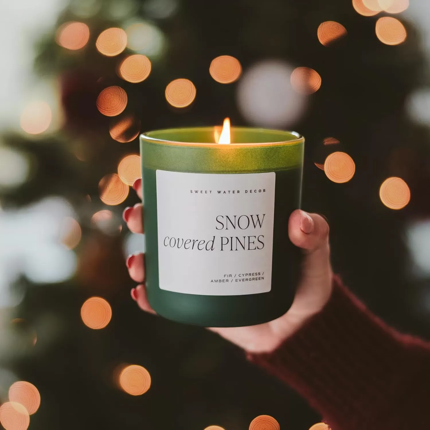 imageSweet Water Decor By The Fireside Candle  Vanilla Caramel Amber Tonka Smoky Woods Musk Winter Scented Soy Candles for Home  15oz Tan Jar 70 Hour Burn Time Made in the USAGreen