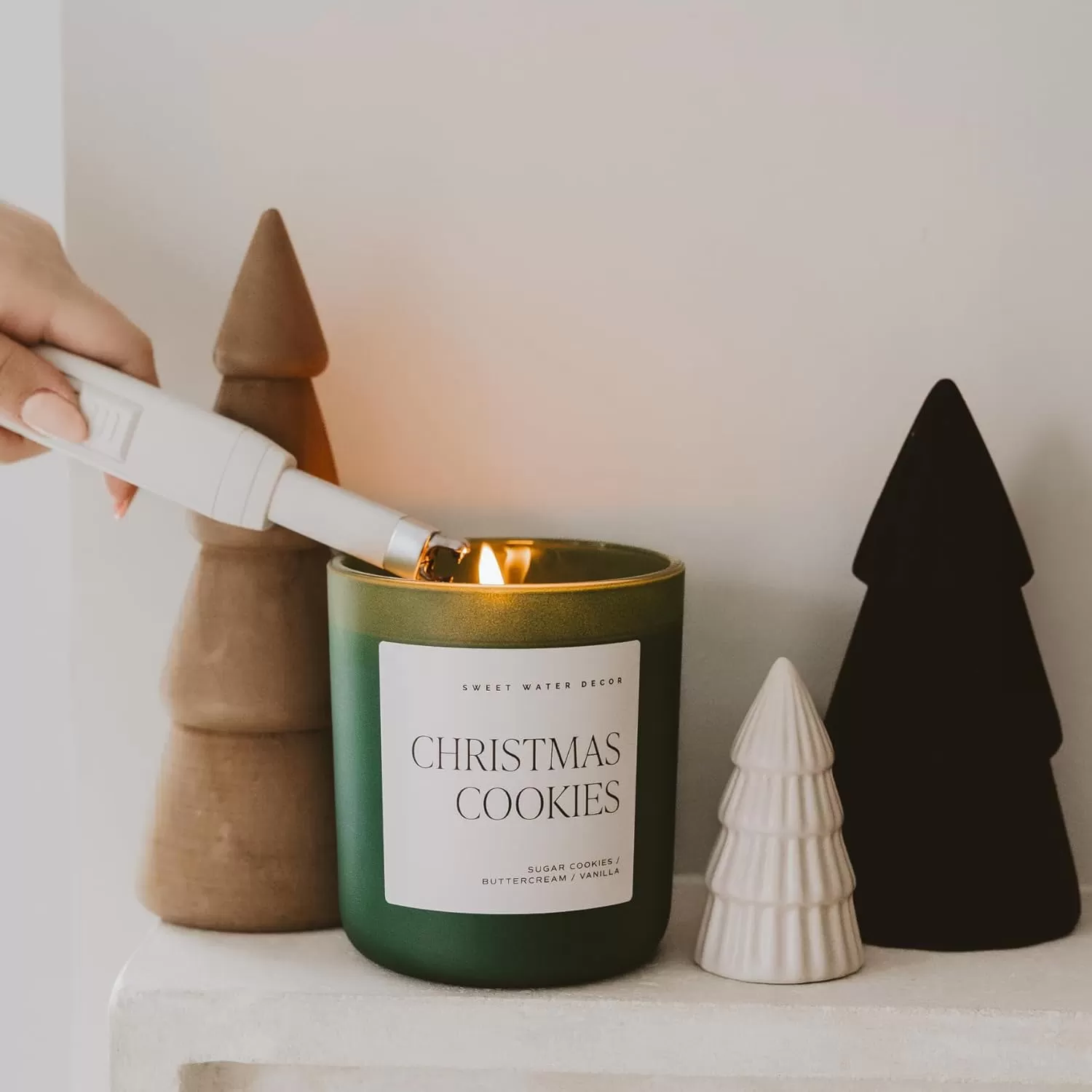 imageSweet Water Decor By The Fireside Candle  Vanilla Caramel Amber Tonka Smoky Woods Musk Winter Scented Soy Candles for Home  15oz Tan Jar 70 Hour Burn Time Made in the USAGreen