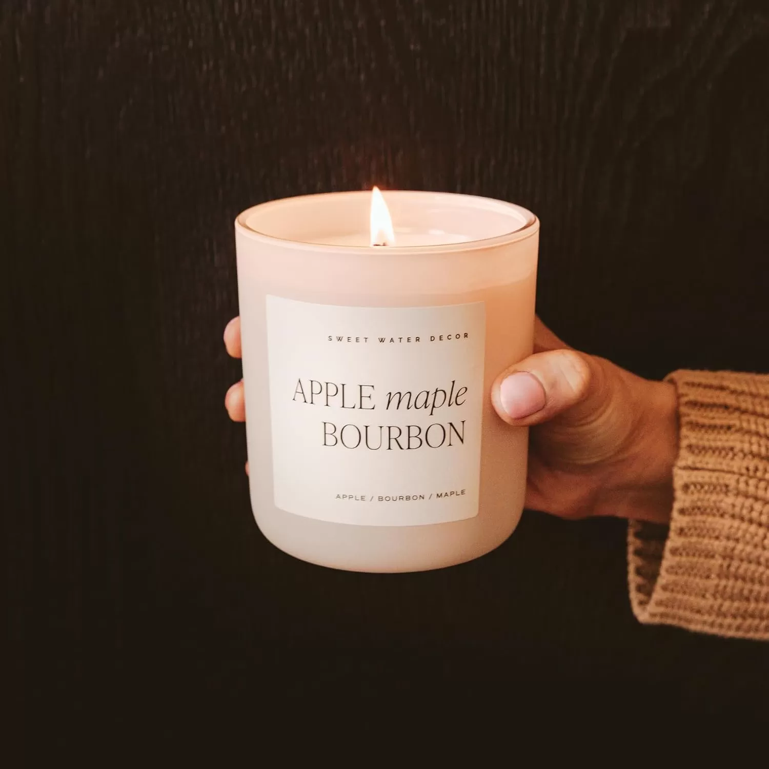 imageSweet Water Decor By The Fireside Candle  Vanilla Caramel Amber Tonka Smoky Woods Musk Winter Scented Soy Candles for Home  15oz Tan Jar 70 Hour Burn Time Made in the USATan