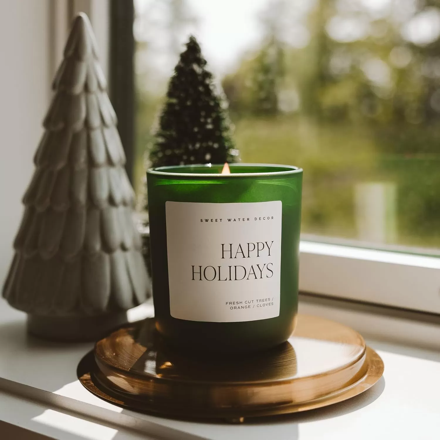 imageSweet Water Decor By The Fireside Candle  Vanilla Caramel Amber Tonka Smoky Woods Musk Winter Scented Soy Candles for Home  15oz Tan Jar 70 Hour Burn Time Made in the USAGreen