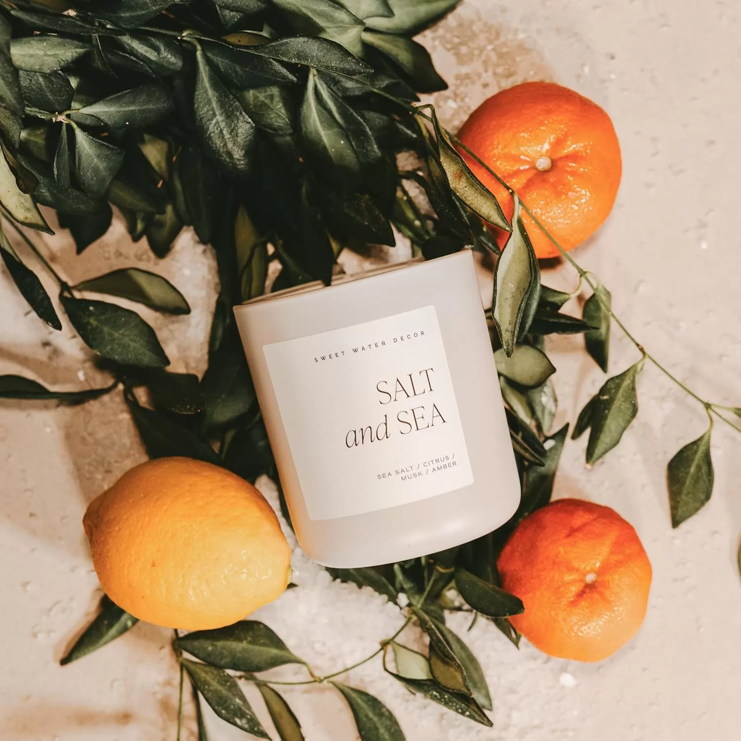 imageSweet Water Decor By The Fireside Candle  Vanilla Caramel Amber Tonka Smoky Woods Musk Winter Scented Soy Candles for Home  15oz Tan Jar 70 Hour Burn Time Made in the USATan