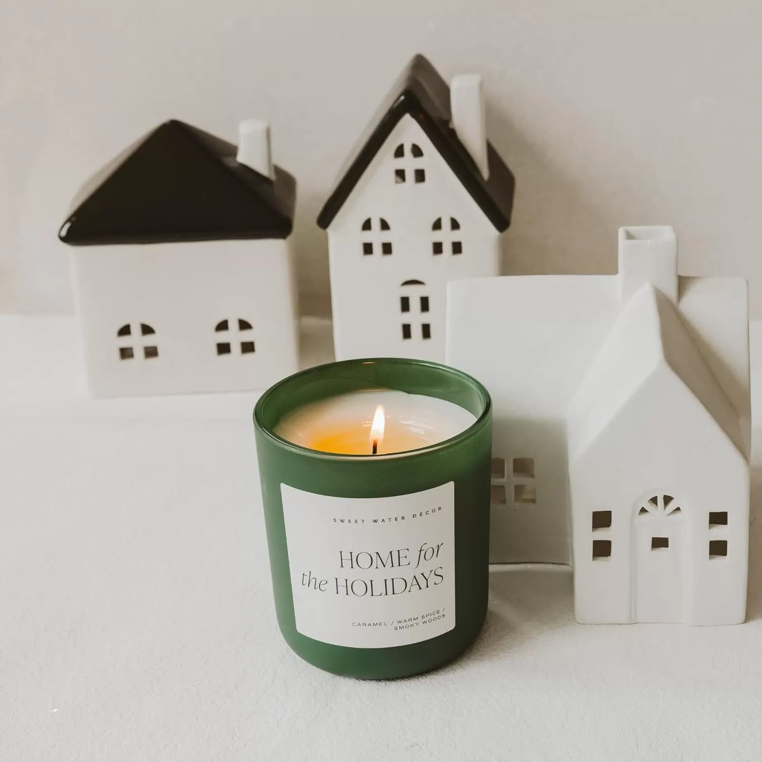 imageSweet Water Decor By The Fireside Candle  Vanilla Caramel Amber Tonka Smoky Woods Musk Winter Scented Soy Candles for Home  15oz Tan Jar 70 Hour Burn Time Made in the USAGreen