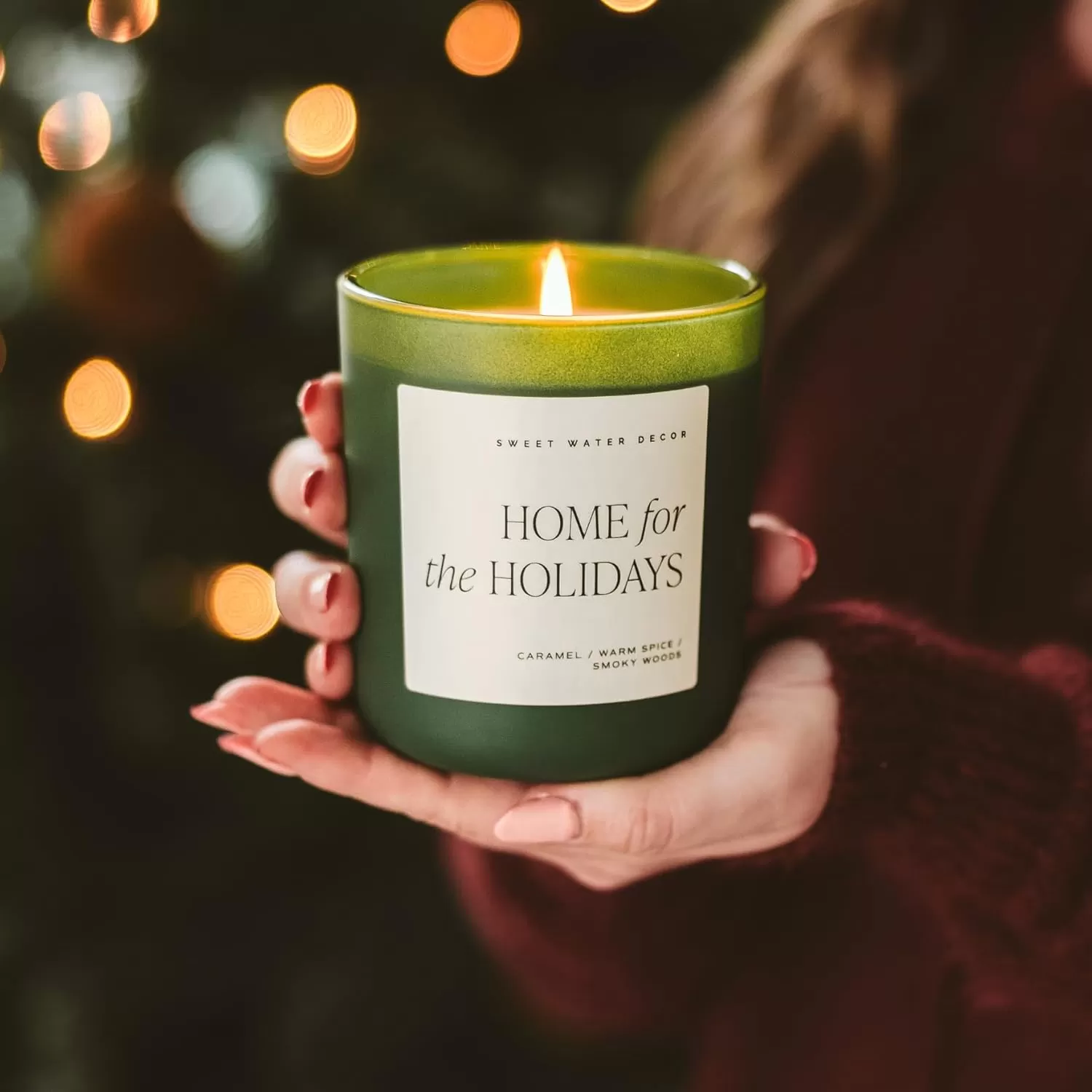 imageSweet Water Decor By The Fireside Candle  Vanilla Caramel Amber Tonka Smoky Woods Musk Winter Scented Soy Candles for Home  15oz Tan Jar 70 Hour Burn Time Made in the USAGreen