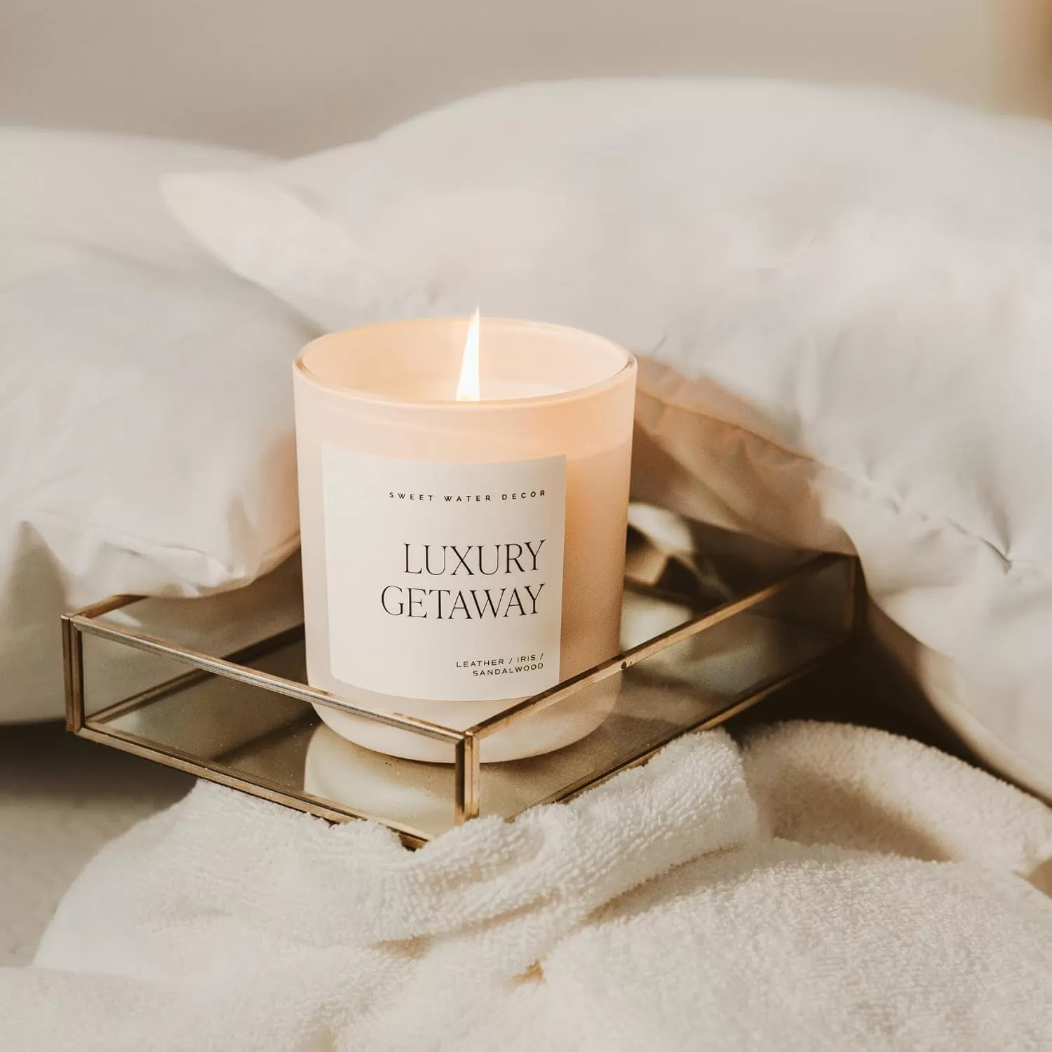 imageSweet Water Decor By The Fireside Candle  Vanilla Caramel Amber Tonka Smoky Woods Musk Winter Scented Soy Candles for Home  15oz Tan Jar 70 Hour Burn Time Made in the USATan