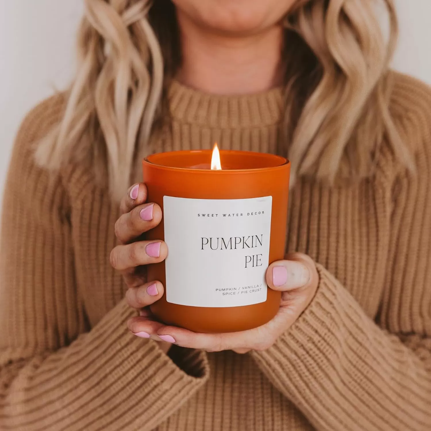 imageSweet Water Decor By The Fireside Candle  Vanilla Caramel Amber Tonka Smoky Woods Musk Winter Scented Soy Candles for Home  15oz Tan Jar 70 Hour Burn Time Made in the USAOrange