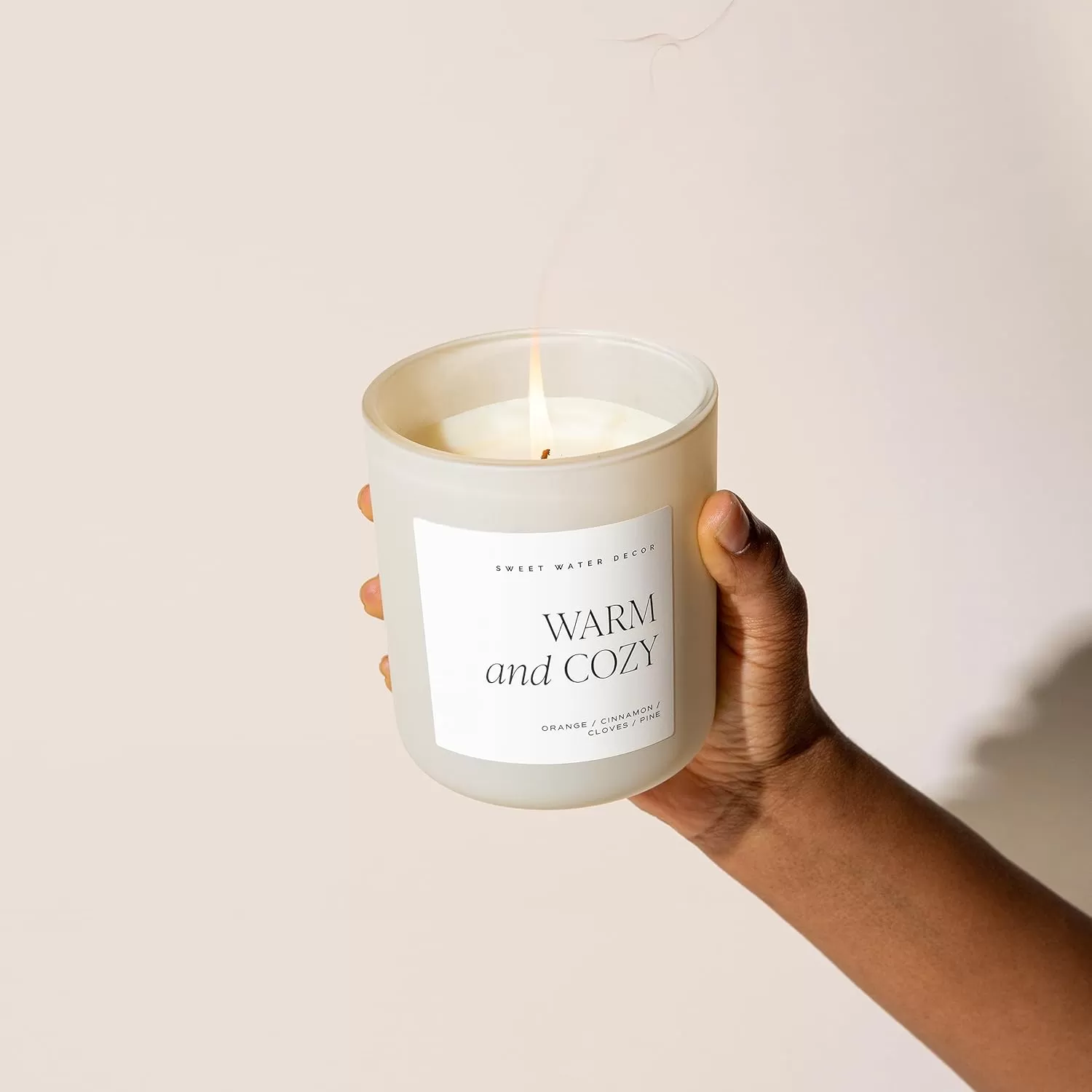 imageSweet Water Decor By The Fireside Candle  Vanilla Caramel Amber Tonka Smoky Woods Musk Winter Scented Soy Candles for Home  15oz Tan Jar 70 Hour Burn Time Made in the USATan
