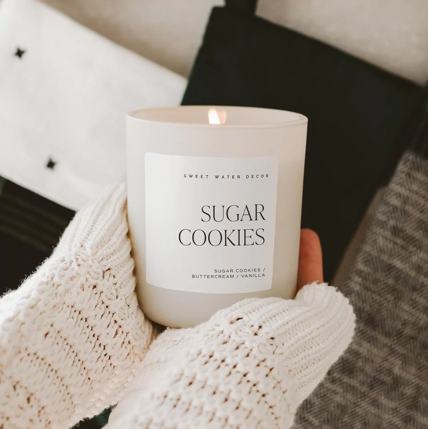 imageSweet Water Decor By The Fireside Candle  Vanilla Caramel Amber Tonka Smoky Woods Musk Winter Scented Soy Candles for Home  15oz Tan Jar 70 Hour Burn Time Made in the USATan