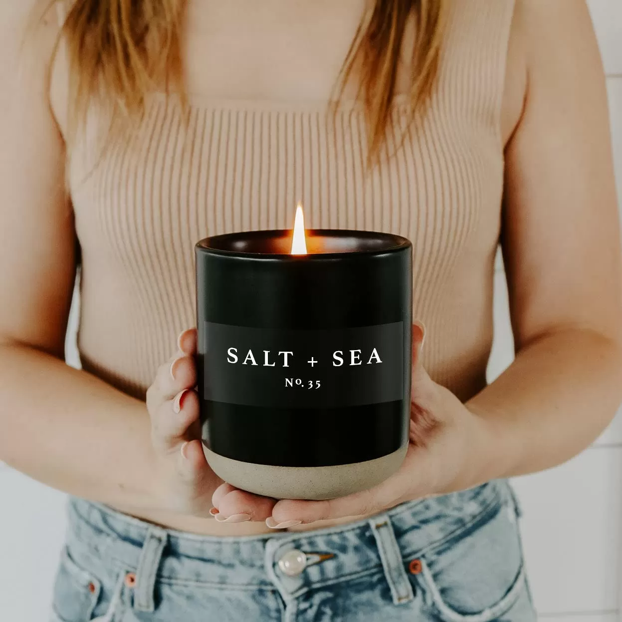 imageSweet Water Decor Christmas Candle  Apple Cider Cinnamon Fresh Cut Christmas Tree and Cookies Scented Soy Candle for Home  12oz Black Stoneware Jar 60 Hour Burn Time Made in the USASalt  Sea