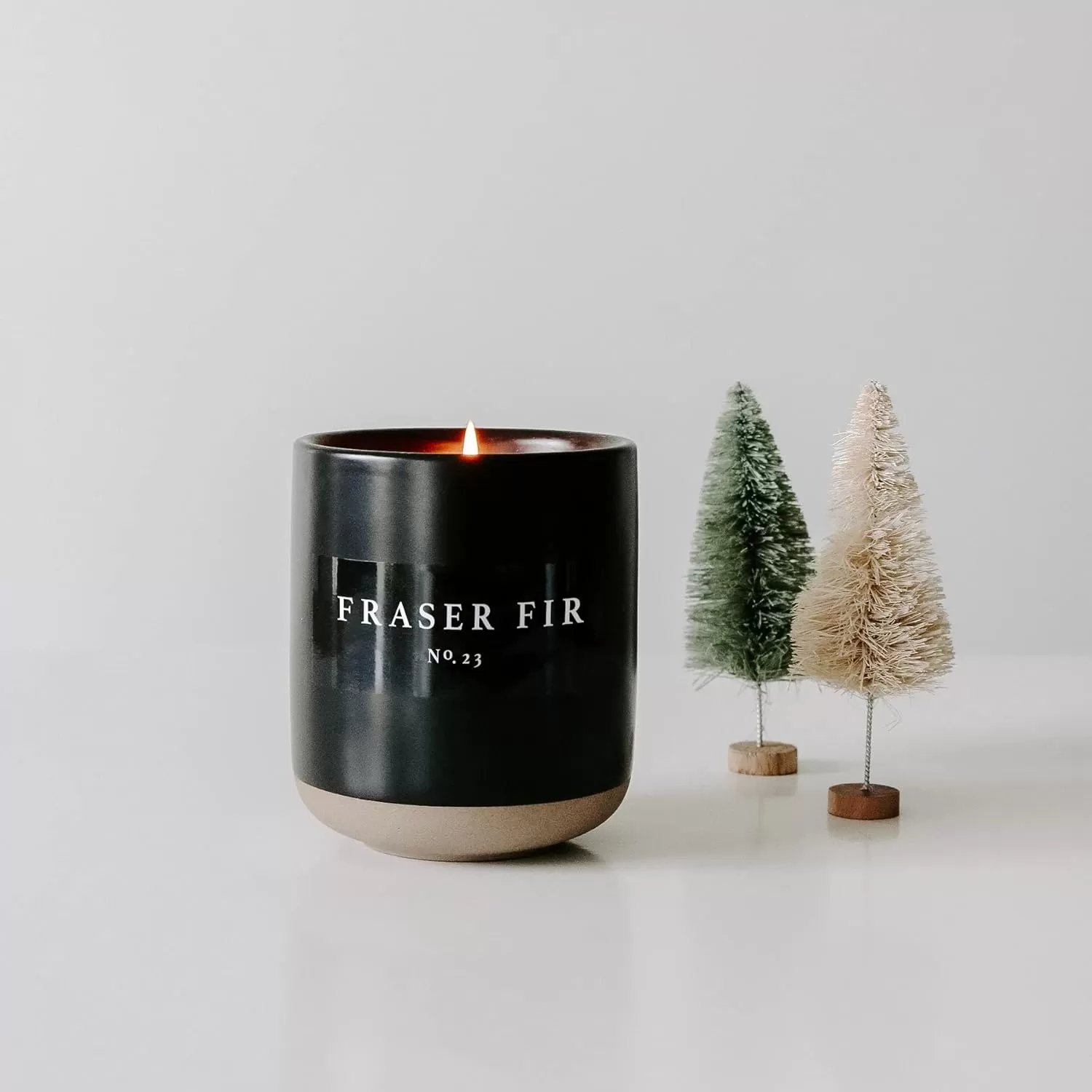 imageSweet Water Decor Christmas Candle  Apple Cider Cinnamon Fresh Cut Christmas Tree and Cookies Scented Soy Candle for Home  12oz Black Stoneware Jar 60 Hour Burn Time Made in the USAFraser Fir