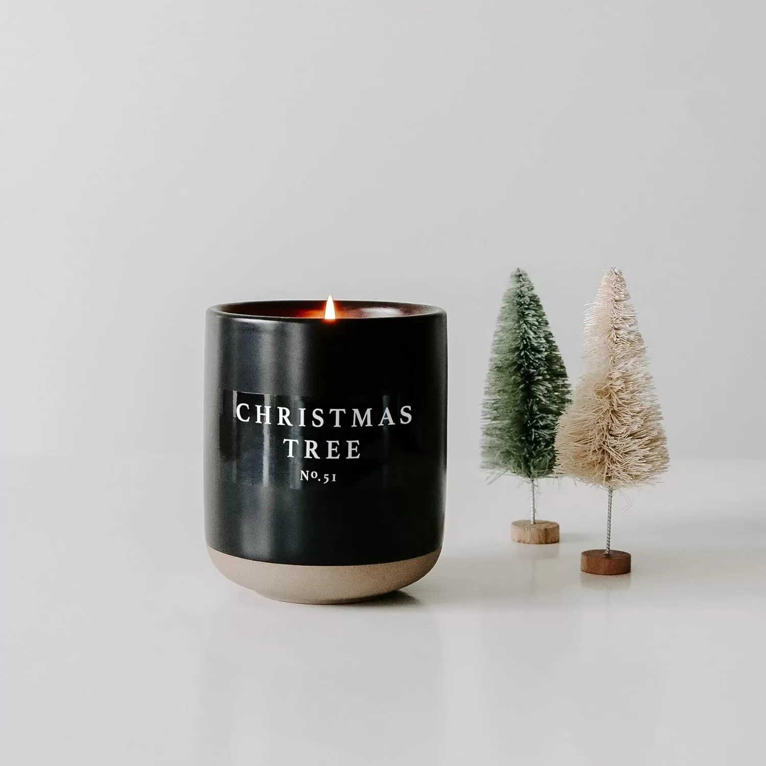 imageSweet Water Decor Christmas Candle  Apple Cider Cinnamon Fresh Cut Christmas Tree and Cookies Scented Soy Candle for Home  12oz Black Stoneware Jar 60 Hour Burn Time Made in the USAChristmas Tree