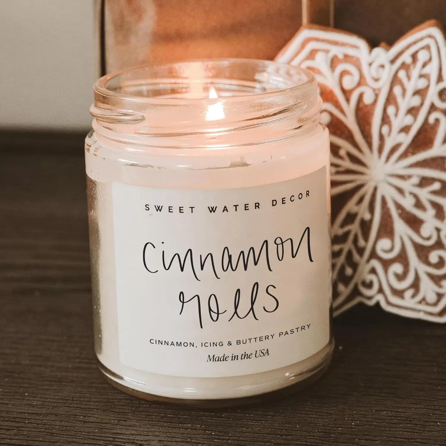 imageSweet Water Decor Christmas Tree Candle  Pine Needles Cedarwood Cypress and Evergreen Soy Holiday Scented Candles for Home  9oz Clear Jar Candle 40 Hour Burn Time Made in the USACinnamon Rolls