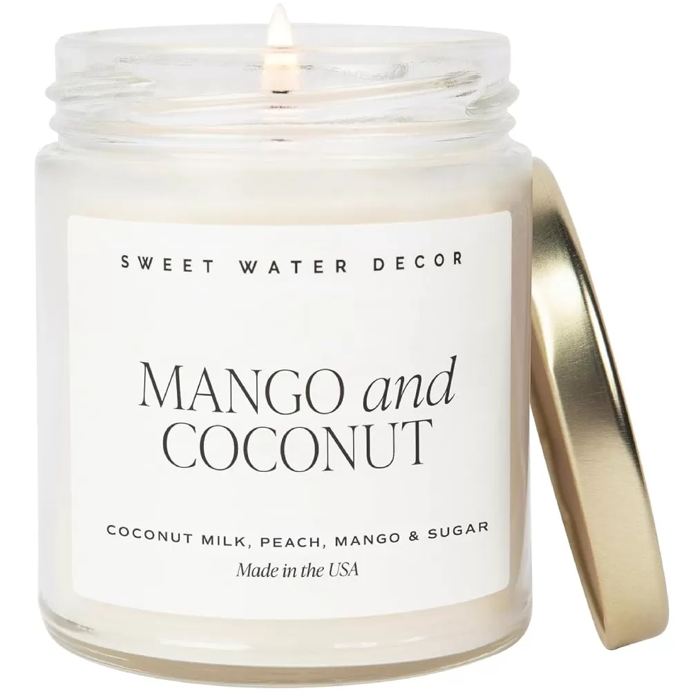 imageSweet Water Decor Christmas Tree Candle  Pine Needles Cedarwood Cypress and Evergreen Soy Holiday Scented Candles for Home  9oz Clear Jar Candle 40 Hour Burn Time Made in the USAMango and Coconut