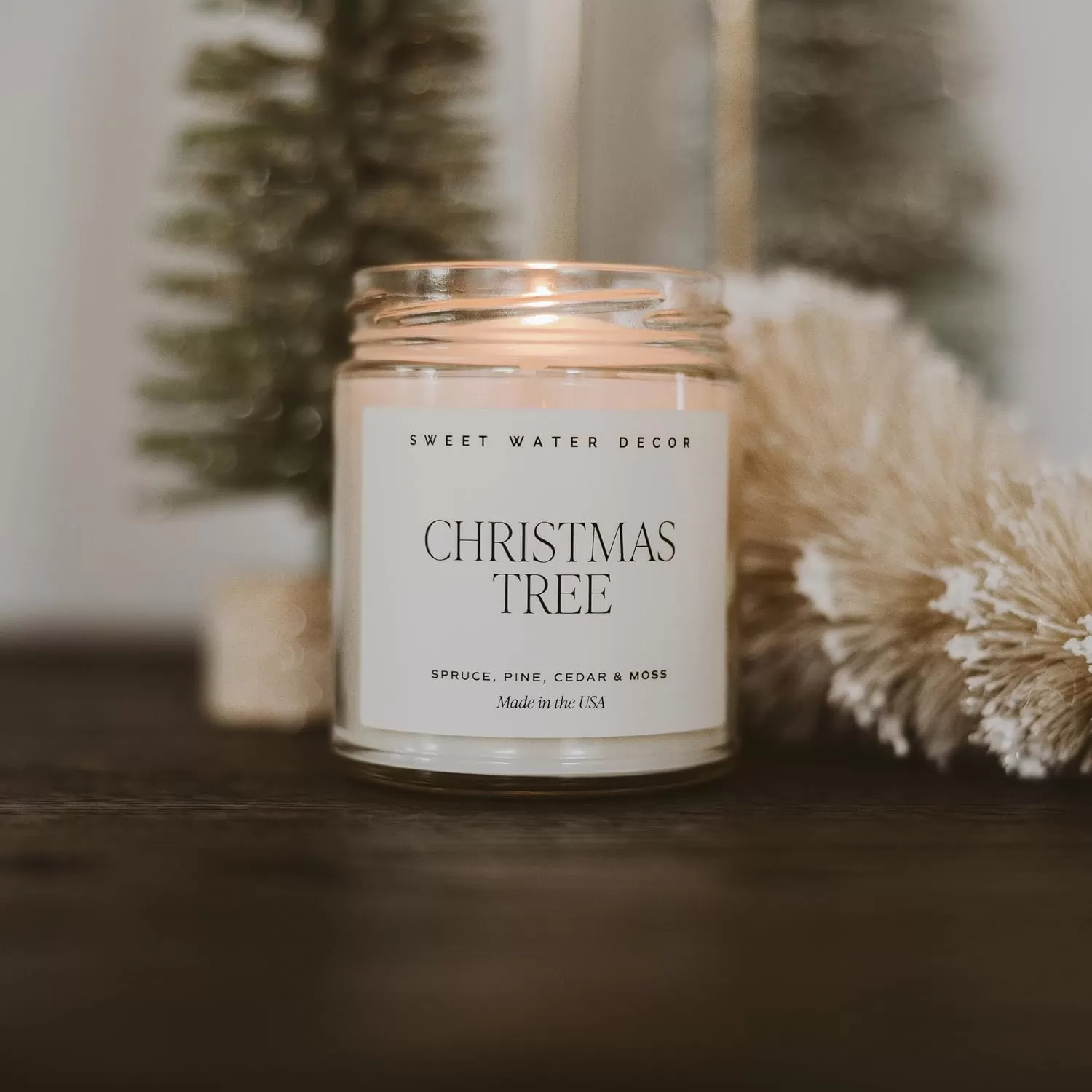 imageSweet Water Decor Christmas Tree Candle  Pine Needles Cedarwood Cypress and Evergreen Soy Holiday Scented Candles for Home  9oz Clear Jar Candle 40 Hour Burn Time Made in the USAChristmas Tree