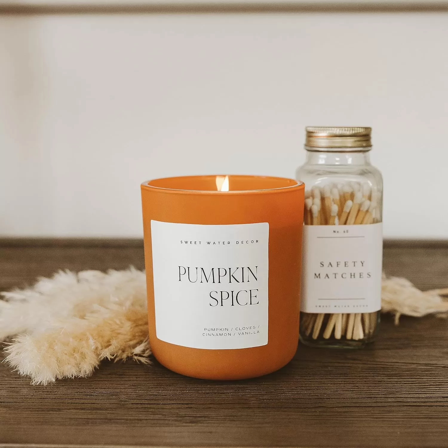 imageSweet Water Decor Cozy Season Soy Candle  Woods Warm Spice and Citrus Scented Candle for Home  15oz Tan Matte Jar 70 Hour Burn Time Made in the USA  Winter Candles for HomeOrange