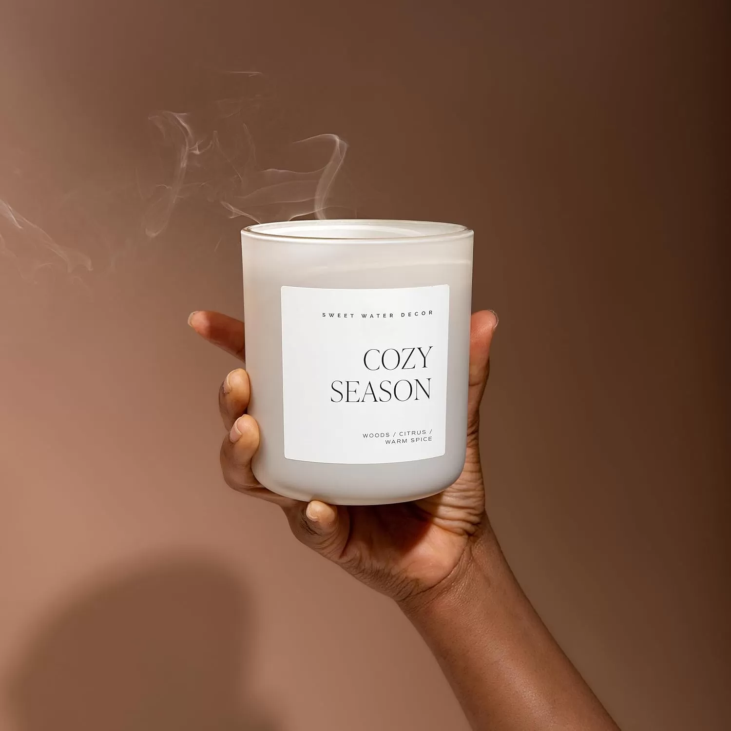 imageSweet Water Decor Cozy Season Soy Candle  Woods Warm Spice and Citrus Scented Candle for Home  15oz Tan Matte Jar 70 Hour Burn Time Made in the USA  Winter Candles for HomeTan