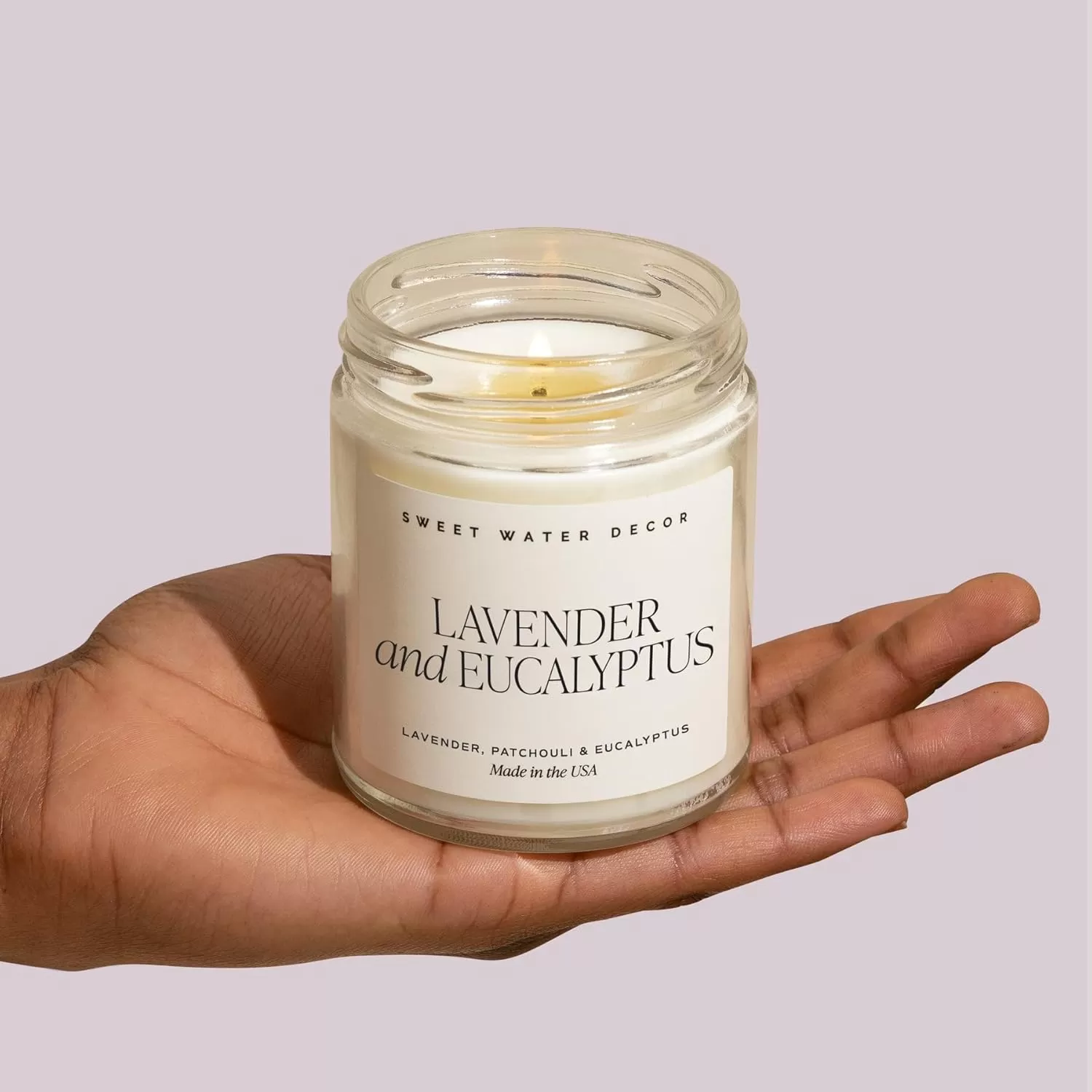 imageSweet Water Decor Driftwood and Mahogany Soy Candle  Warm Mahogany Fresh Lavender Geranium and Teakwood Scented Candles for Home  9oz Clear Jar  Gold Lid 40 Hour Burn Time Made in the USALavender and Eucalyptus