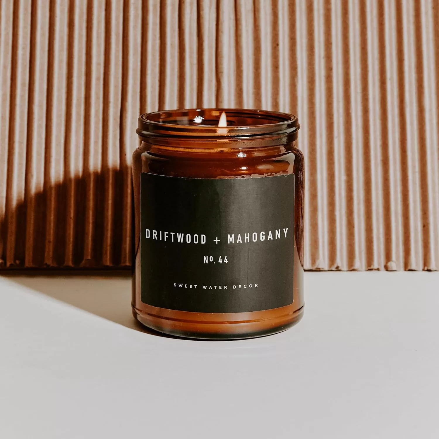 imageSweet Water Decor Palo Santo Patchouli Candle  Vanilla Musk Sandalwood Patchouli Scented Soy Candles for Home  Gifts for Women Men Housewarming  9oz Amber Jar 40 Hour Burn TimeDriftwood and Mahogany