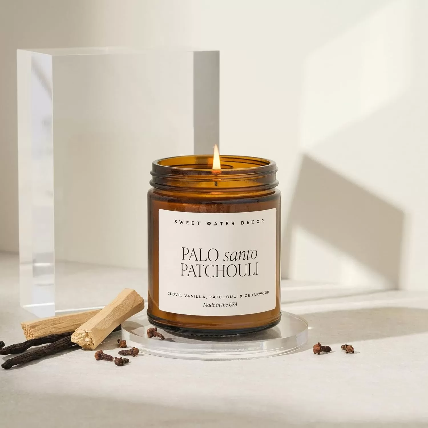 imageSweet Water Decor Palo Santo Patchouli Candle  Vanilla Musk Sandalwood Patchouli Scented Soy Candles for Home  Gifts for Women Men Housewarming  9oz Amber Jar 40 Hour Burn TimePalo Santo Patchouli