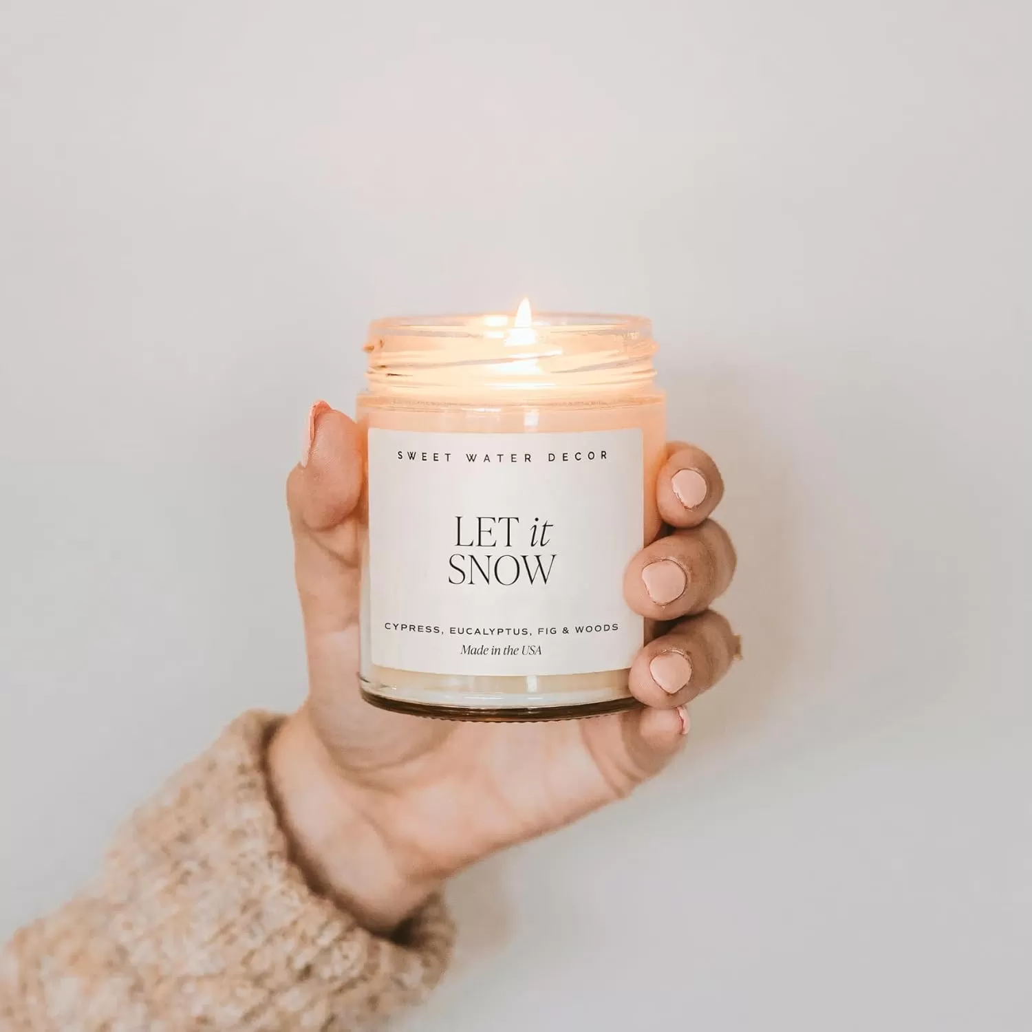 imageSweet Water Decor Relaxation Soy Candle  Eucalyptus Peppermint and Clove Scented Candles for Home  9oz Clear Jar  Gold Lid 40 Hour Burn Time Made in the USALet It Snow