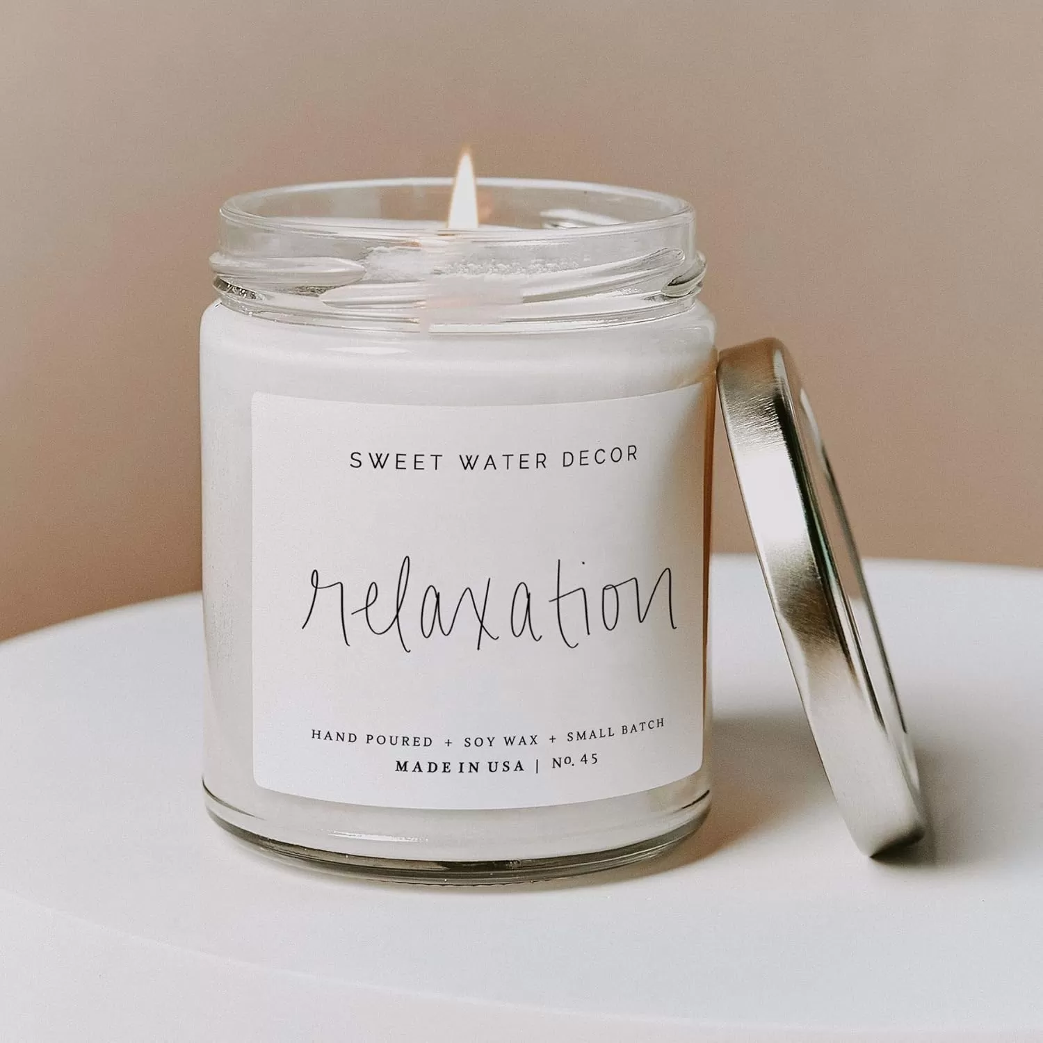 imageSweet Water Decor Relaxation Soy Candle  Eucalyptus Peppermint and Clove Scented Candles for Home  9oz Clear Jar  Gold Lid 40 Hour Burn Time Made in the USARelaxation