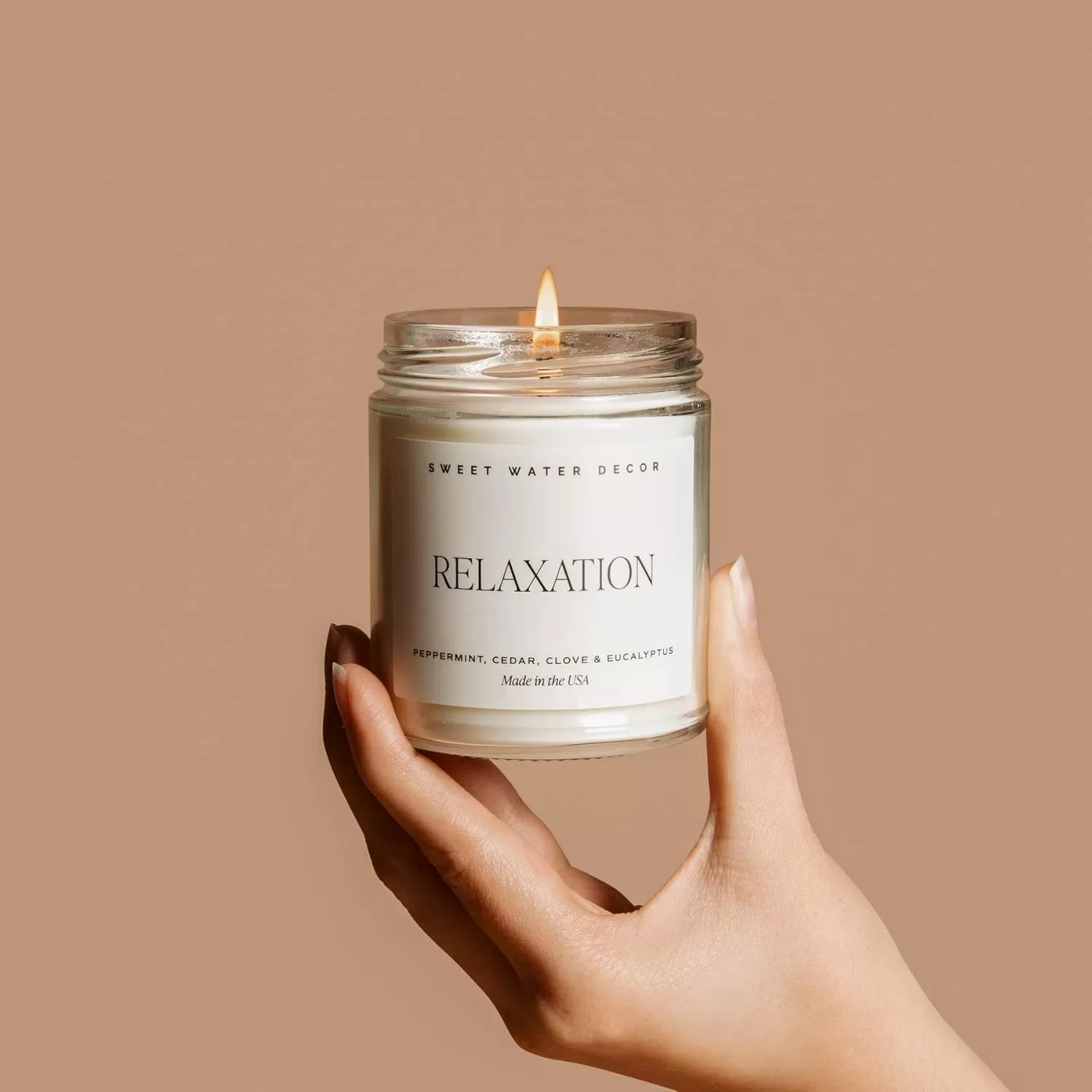 imageSweet Water Decor Relaxation Soy Candle  Eucalyptus Peppermint and Clove Scented Candles for Home  9oz Clear Jar  Gold Lid 40 Hour Burn Time Made in the USARelaxation