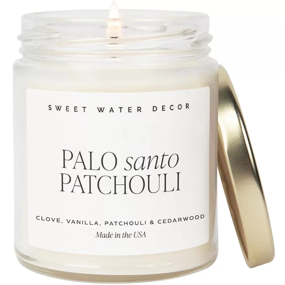 imageSweet Water Decor Relaxation Soy Candle  Eucalyptus Peppermint and Clove Scented Candles for Home  9oz Clear Jar  Gold Lid 40 Hour Burn Time Made in the USAPalo Santo Patchouli