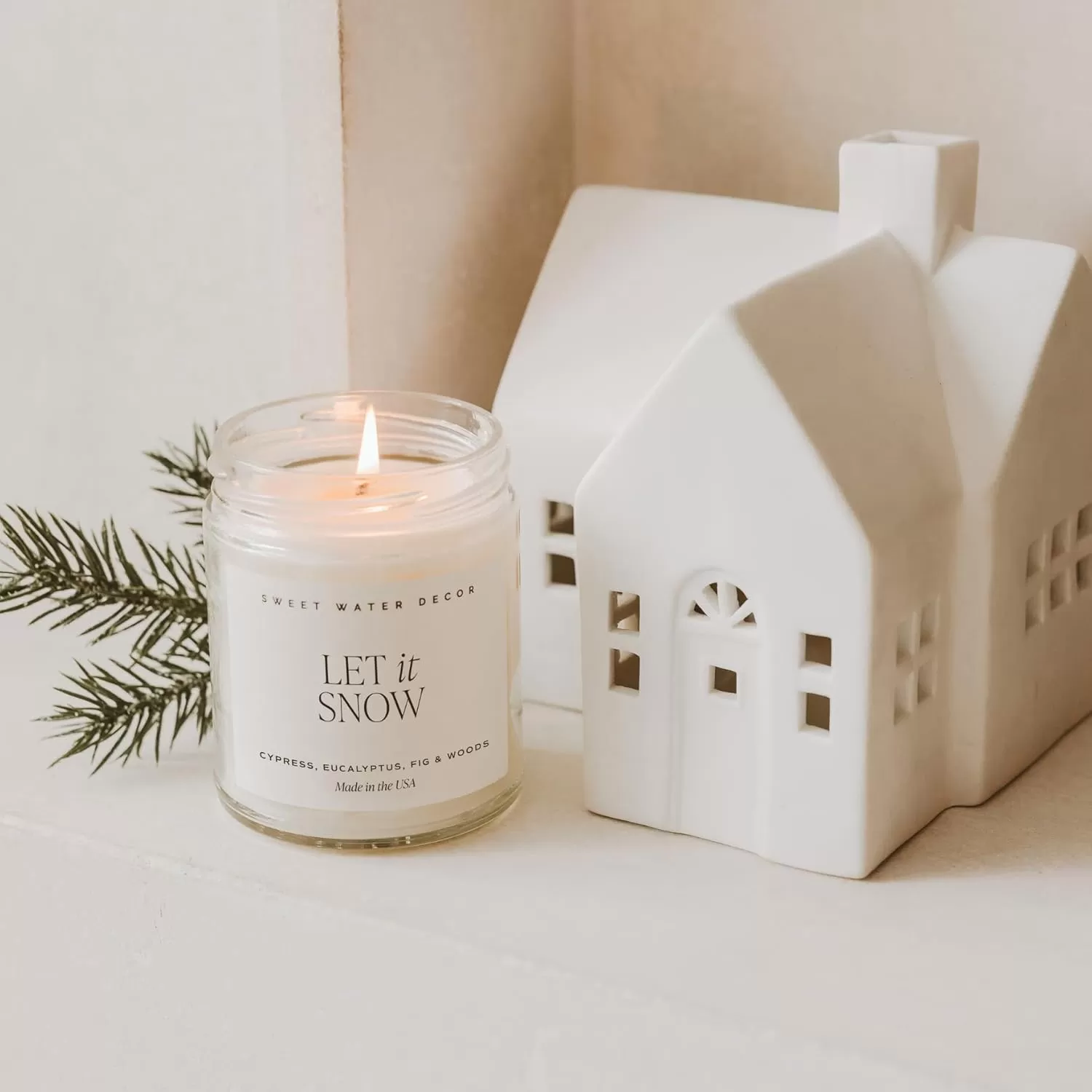 imageSweet Water Decor Relaxation Soy Candle  Eucalyptus Peppermint and Clove Scented Candles for Home  9oz Clear Jar  Gold Lid 40 Hour Burn Time Made in the USALet It Snow