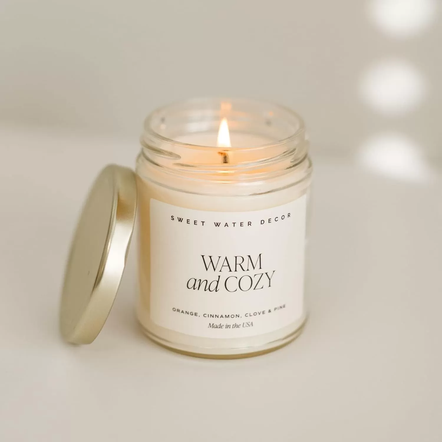 imageSweet Water Decor Relaxation Soy Candle  Eucalyptus Peppermint and Clove Scented Candles for Home  9oz Clear Jar  Gold Lid 40 Hour Burn Time Made in the USAWarm and Cozy