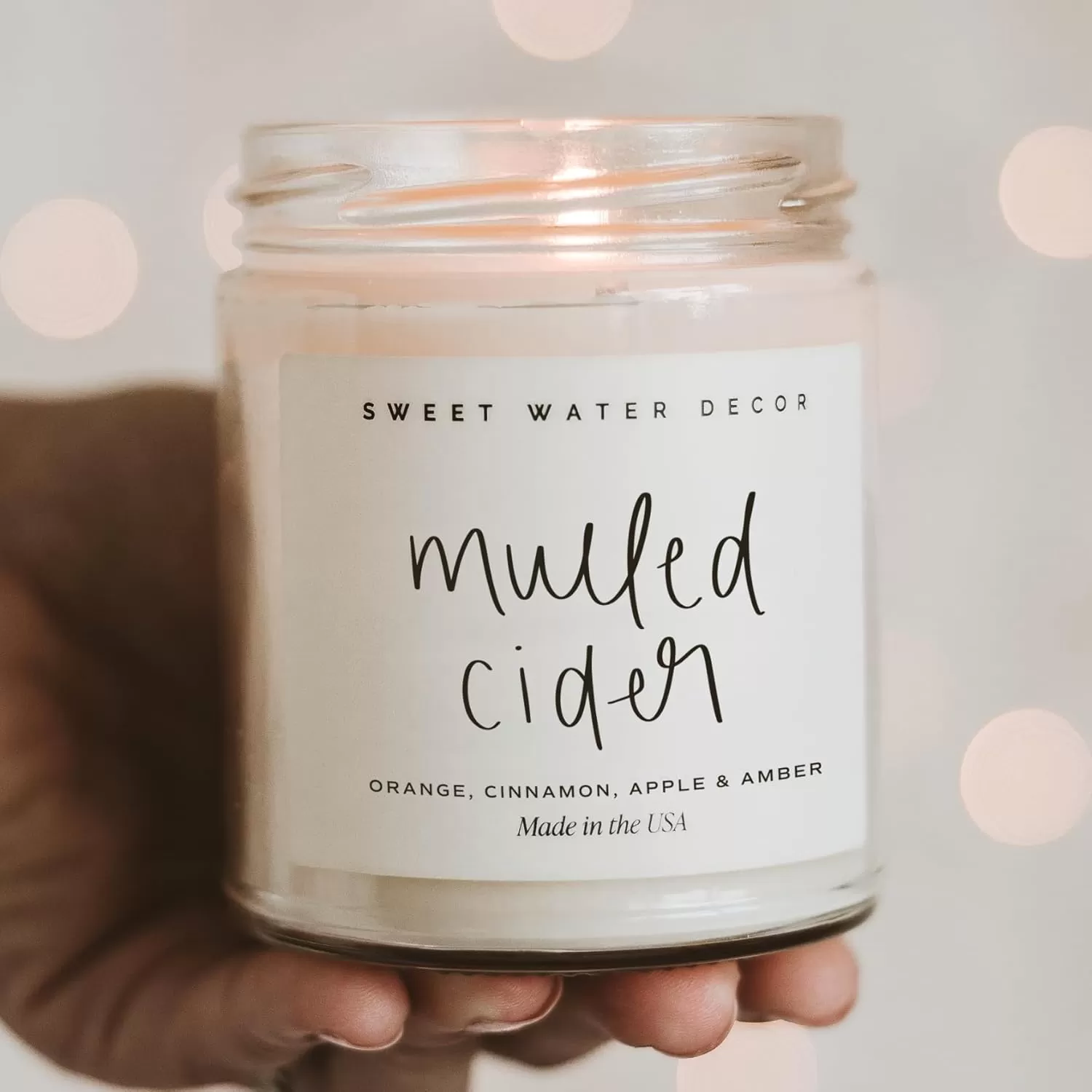 imageSweet Water Decor Spa Day Soy Candle  Sea Salt Jasmine Wood and Cream Scented Candles for Home  9oz Clear Jar  Gold Lid 40 Hour Burn Time Made in the USAMulled Cider