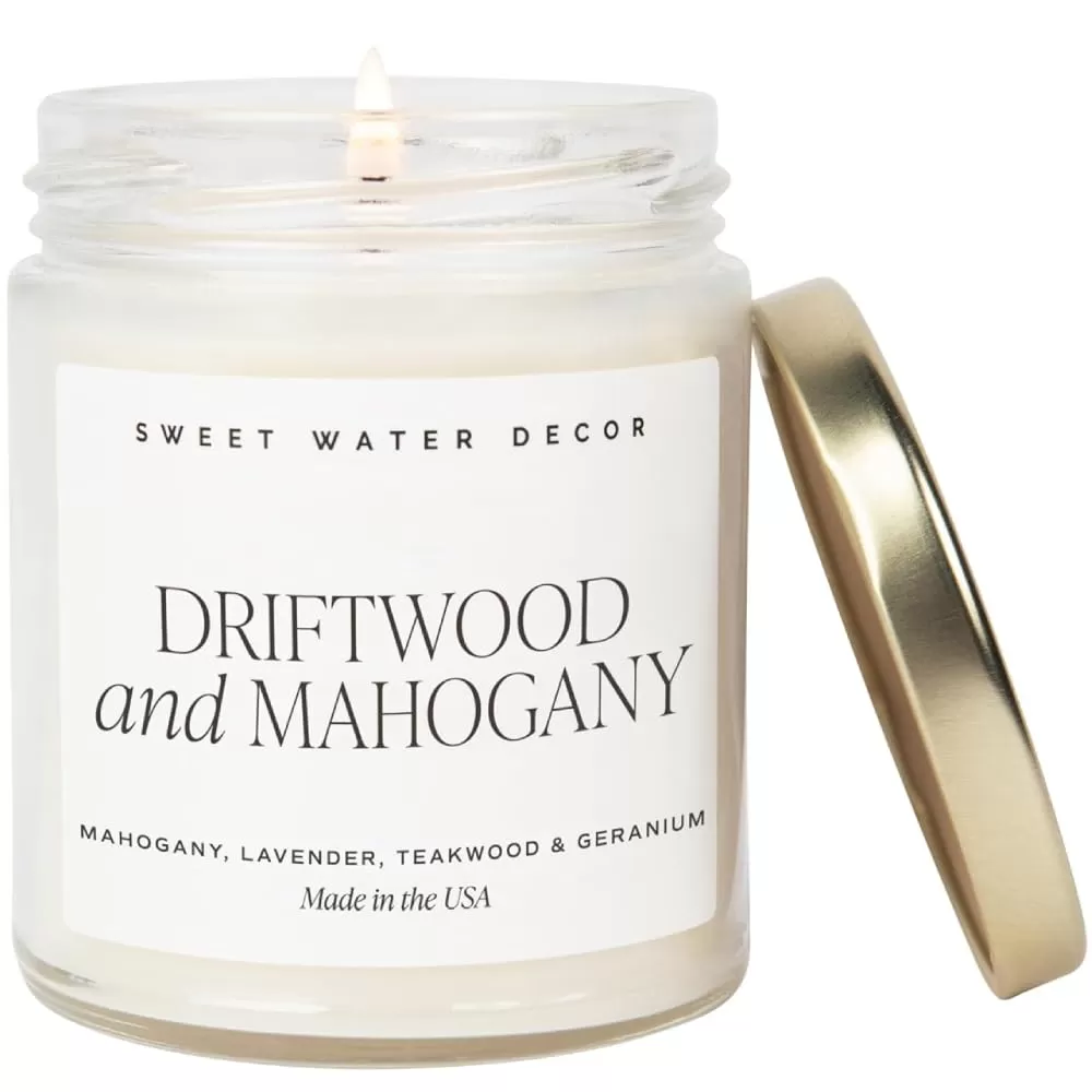 imageSweet Water Decor Spa Day Soy Candle  Sea Salt Jasmine Wood and Cream Scented Candles for Home  9oz Clear Jar  Gold Lid 40 Hour Burn Time Made in the USADriftwood and Mahogany