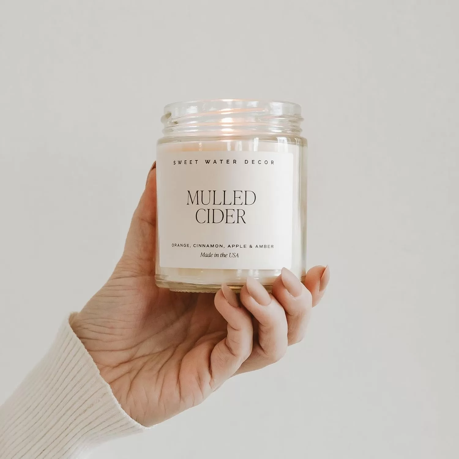 imageSweet Water Decor Spa Day Soy Candle  Sea Salt Jasmine Wood and Cream Scented Candles for Home  9oz Clear Jar  Gold Lid 40 Hour Burn Time Made in the USAMulled Cider
