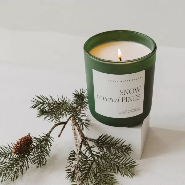 imageSweet Water Decor By The Fireside Candle  Vanilla Caramel Amber Tonka Smoky Woods Musk Winter Scented Soy Candles for Home  15oz Tan Jar 70 Hour Burn Time Made in the USAGreen