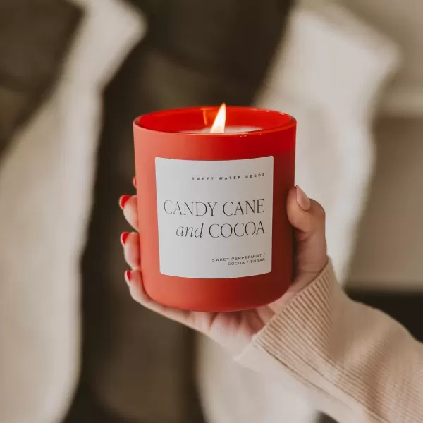 imageSweet Water Decor By The Fireside Candle  Vanilla Caramel Amber Tonka Smoky Woods Musk Winter Scented Soy Candles for Home  15oz Tan Jar 70 Hour Burn Time Made in the USARed