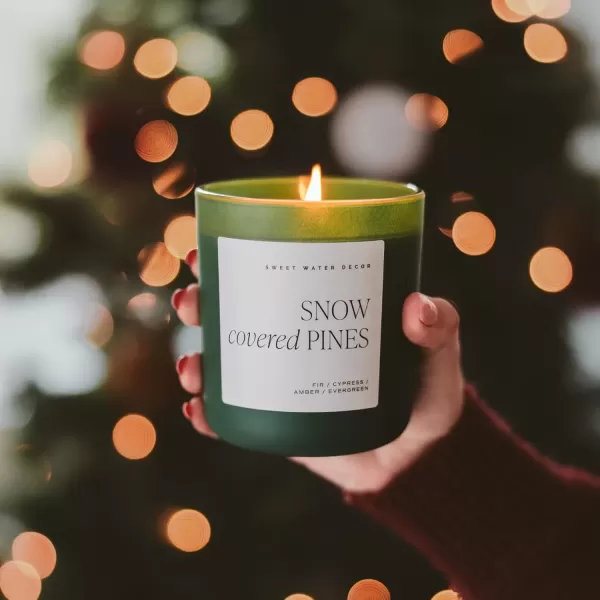 imageSweet Water Decor By The Fireside Candle  Vanilla Caramel Amber Tonka Smoky Woods Musk Winter Scented Soy Candles for Home  15oz Tan Jar 70 Hour Burn Time Made in the USAGreen