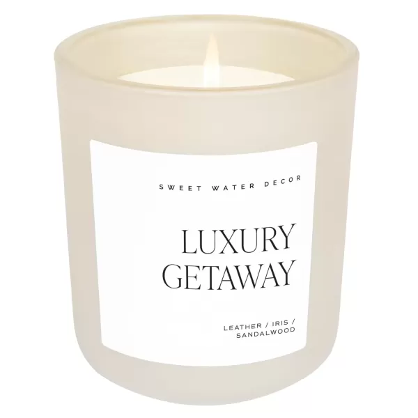 imageSweet Water Decor By The Fireside Candle  Vanilla Caramel Amber Tonka Smoky Woods Musk Winter Scented Soy Candles for Home  15oz Tan Jar 70 Hour Burn Time Made in the USATan