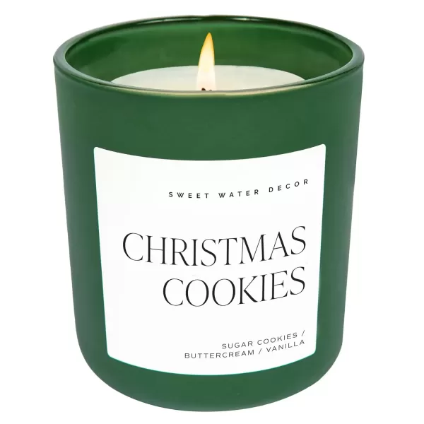 imageSweet Water Decor By The Fireside Candle  Vanilla Caramel Amber Tonka Smoky Woods Musk Winter Scented Soy Candles for Home  15oz Tan Jar 70 Hour Burn Time Made in the USAGreen