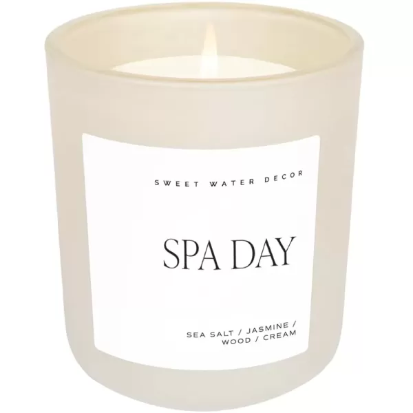 imageSweet Water Decor By The Fireside Candle  Vanilla Caramel Amber Tonka Smoky Woods Musk Winter Scented Soy Candles for Home  15oz Tan Jar 70 Hour Burn Time Made in the USATan