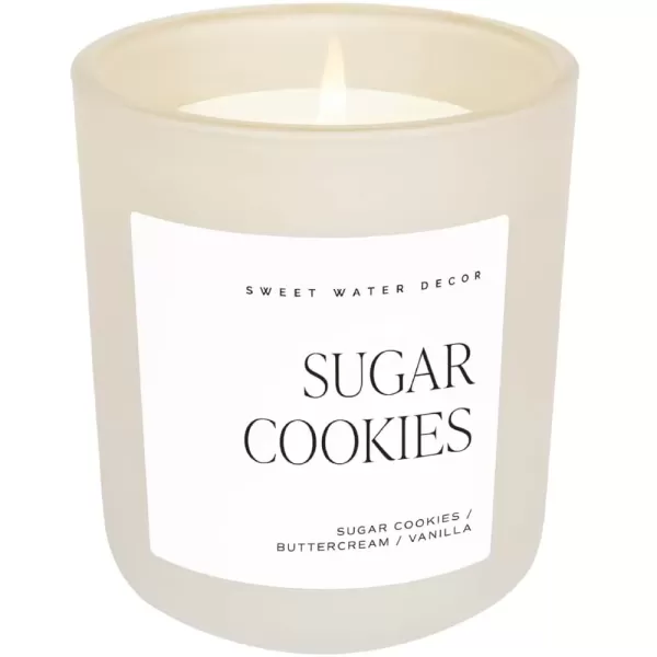 imageSweet Water Decor By The Fireside Candle  Vanilla Caramel Amber Tonka Smoky Woods Musk Winter Scented Soy Candles for Home  15oz Tan Jar 70 Hour Burn Time Made in the USATan