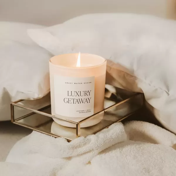 imageSweet Water Decor By The Fireside Candle  Vanilla Caramel Amber Tonka Smoky Woods Musk Winter Scented Soy Candles for Home  15oz Tan Jar 70 Hour Burn Time Made in the USATan