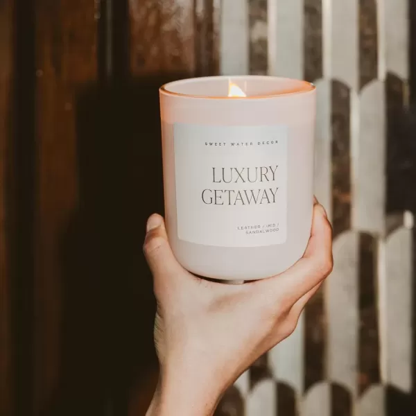 imageSweet Water Decor By The Fireside Candle  Vanilla Caramel Amber Tonka Smoky Woods Musk Winter Scented Soy Candles for Home  15oz Tan Jar 70 Hour Burn Time Made in the USATan