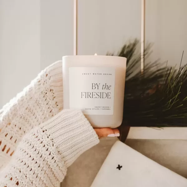 imageSweet Water Decor By The Fireside Candle  Vanilla Caramel Amber Tonka Smoky Woods Musk Winter Scented Soy Candles for Home  15oz Tan Jar 70 Hour Burn Time Made in the USATan