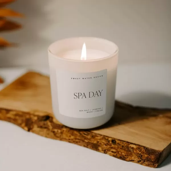 imageSweet Water Decor By The Fireside Candle  Vanilla Caramel Amber Tonka Smoky Woods Musk Winter Scented Soy Candles for Home  15oz Tan Jar 70 Hour Burn Time Made in the USATan