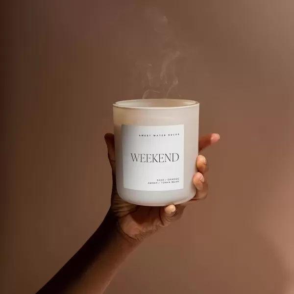 imageSweet Water Decor By The Fireside Candle  Vanilla Caramel Amber Tonka Smoky Woods Musk Winter Scented Soy Candles for Home  15oz Tan Jar 70 Hour Burn Time Made in the USATan