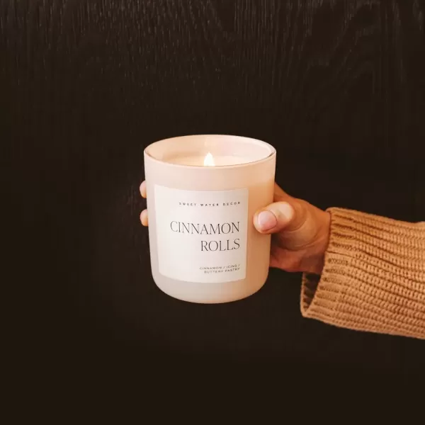 imageSweet Water Decor By The Fireside Candle  Vanilla Caramel Amber Tonka Smoky Woods Musk Winter Scented Soy Candles for Home  15oz Tan Jar 70 Hour Burn Time Made in the USATan