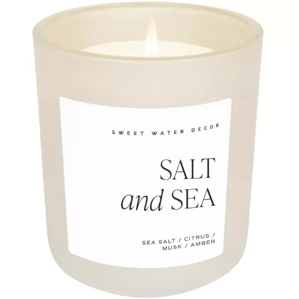 imageSweet Water Decor By The Fireside Candle  Vanilla Caramel Amber Tonka Smoky Woods Musk Winter Scented Soy Candles for Home  15oz Tan Jar 70 Hour Burn Time Made in the USATan