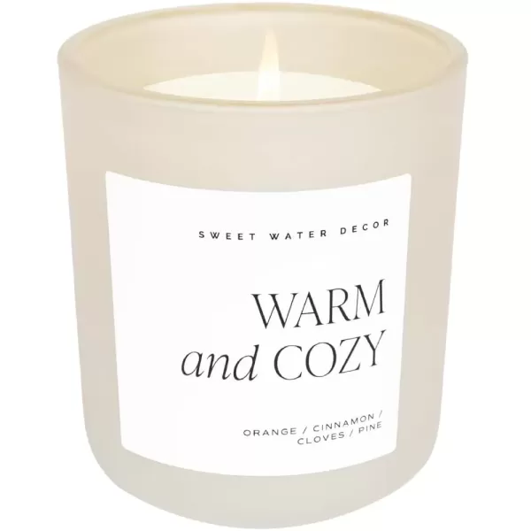 imageSweet Water Decor By The Fireside Candle  Vanilla Caramel Amber Tonka Smoky Woods Musk Winter Scented Soy Candles for Home  15oz Tan Jar 70 Hour Burn Time Made in the USATan